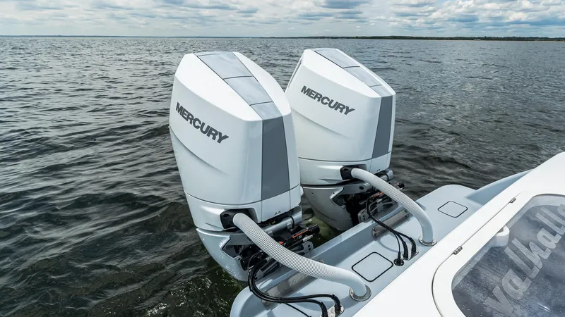 Slide: The Image of 2025 Valhalla Boatworks V-33 with dual Mercury outboard engines on open water. - 8