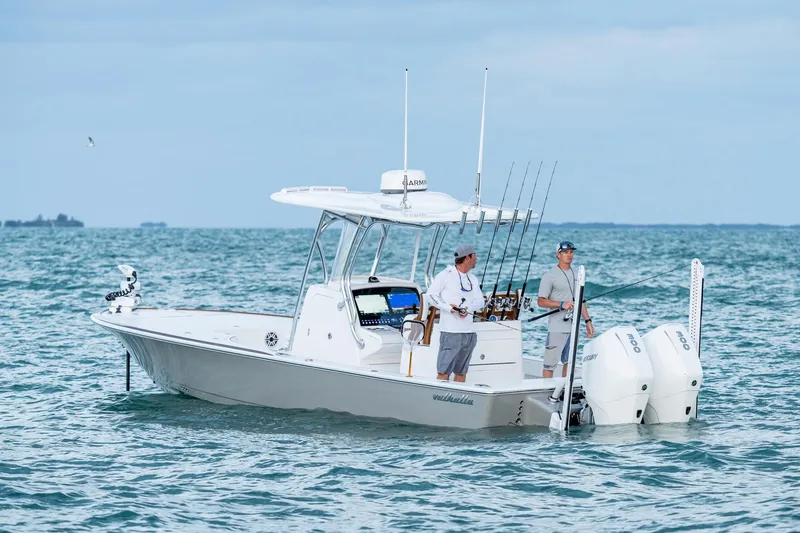Slide: The Image of 2025 Valhalla Boatworks V-28 Bay on water with two people fishing. - 7