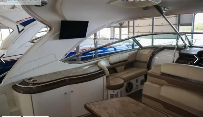 Slide: The Image of 2016 Formula 400 Super Sport yacht interior with luxurious seating and modern amenities. - 10