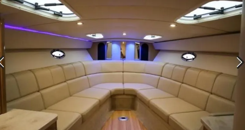 Slide: The Image of Luxurious interior of 2016 Formula 400 Super Sport yacht with plush seating and ambient lighting. - 11