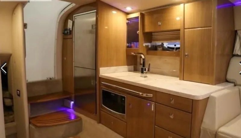 Slide: The Image of Interior of 2016 Formula 400 Super Sport yacht with modern kitchen amenities. - 12