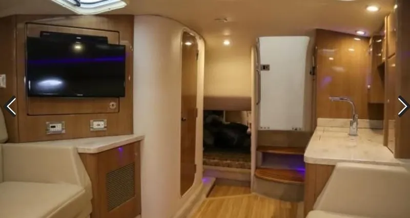 Slide: The Image of Interior of 2016 Formula 400 Super Sport yacht, featuring modern amenities and wood finishes. - 13