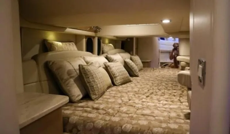 Slide: The Image of Luxurious cabin interior of a 2016 Formula 400 Super Sport yacht with plush bedding. - 14