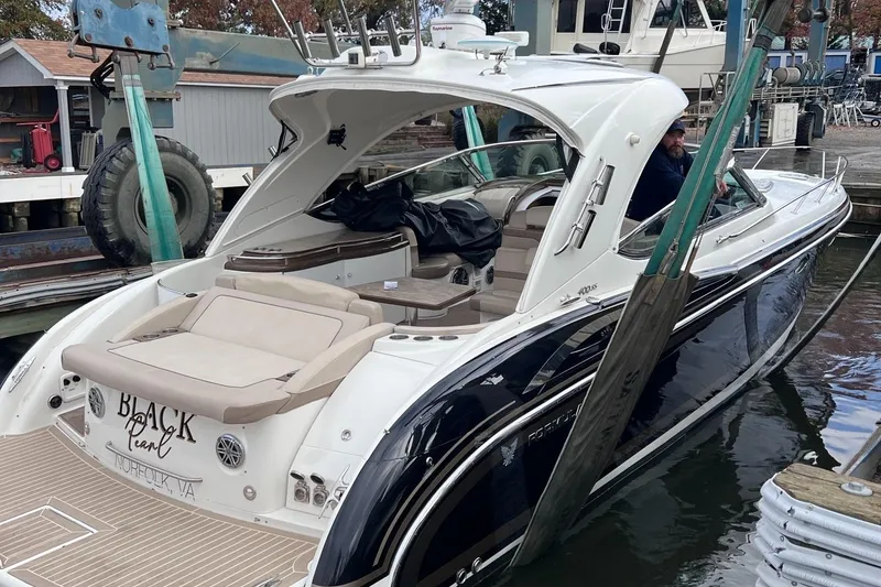 Slide: The Image of 2016 Formula 400 Super Sport boat docked, featuring sleek design and spacious seating. - 20