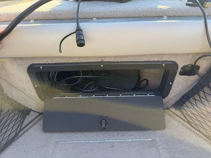 Slide: The Image of Open storage compartment in a 2001 Lund 1950 Tyee Magnum GS ITS boat. - 12