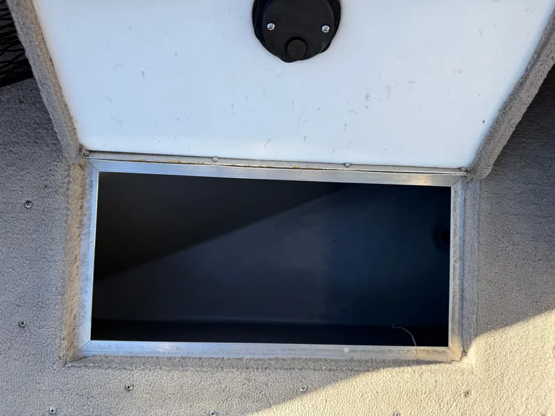 Slide: The Image of Open storage compartment on a 2001 Lund 1950 Tyee Magnum GS ITS boat. - 15