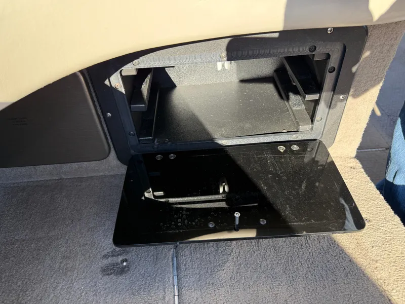 Slide: The Image of Open storage compartment in a 2001 Lund 1950 Tyee Magnum GS ITS boat. - 16