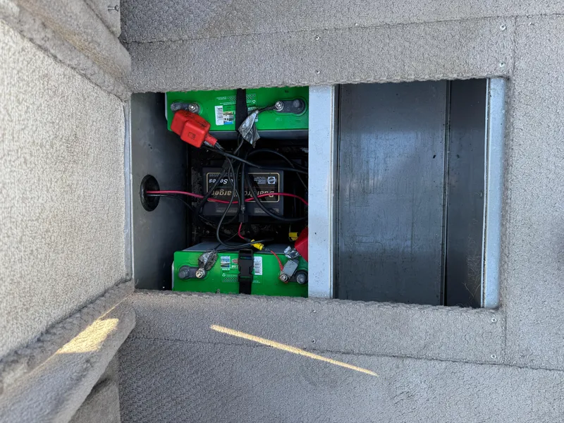 Slide: The Image of Battery compartment of a 2001 Lund 1950 Tyee Magnum GS ITS boat. - 18