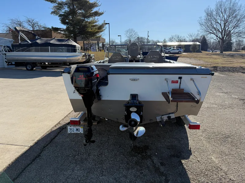 Slide: The Image of 2001 Lund 1950 Tyee Magnum GS ITS boat, rear view, parked outdoors. - 2