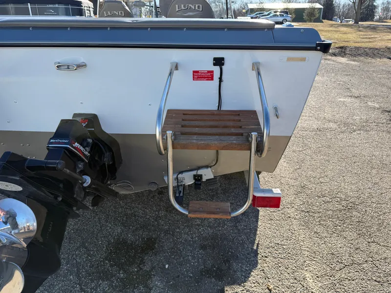 Slide: The Image of 2001 Lund 1950 Tyee Magnum GS ITS boat stern with ladder and motor. - 3