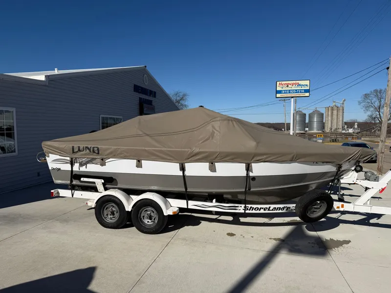 Slide: The Image of 2001 Lund 1950 Tyee Magnum GS ITS boat on trailer, covered, outdoors. - 34