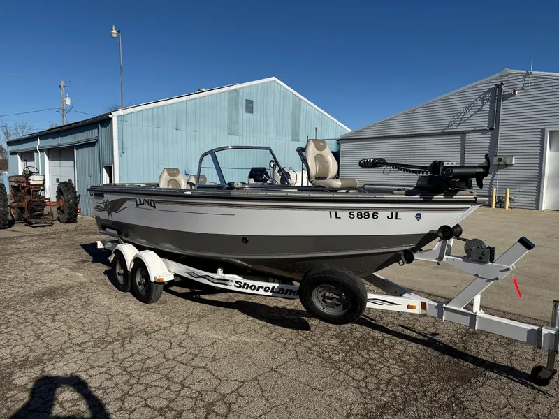 Slide: The Image of 2001 Lund 1950 Tyee Magnum GS ITS boat on trailer, parked outdoors. - 6