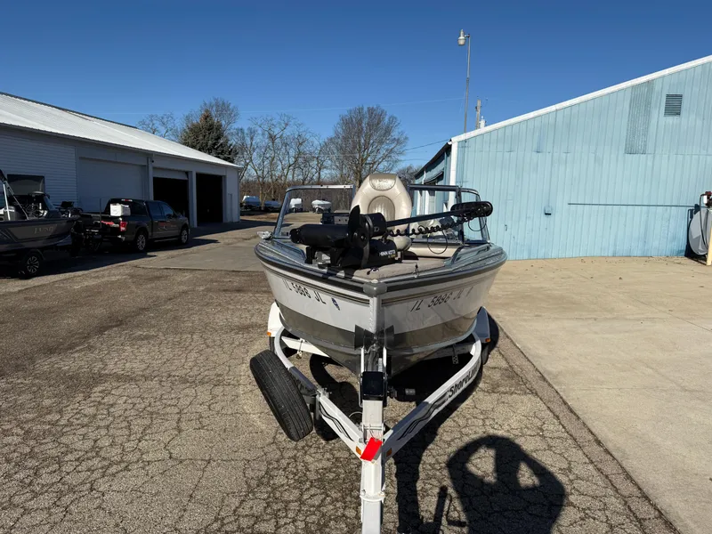 Slide: The Image of 2001 Lund 1950 Tyee Magnum GS ITS boat on trailer, parked outdoors. - 7