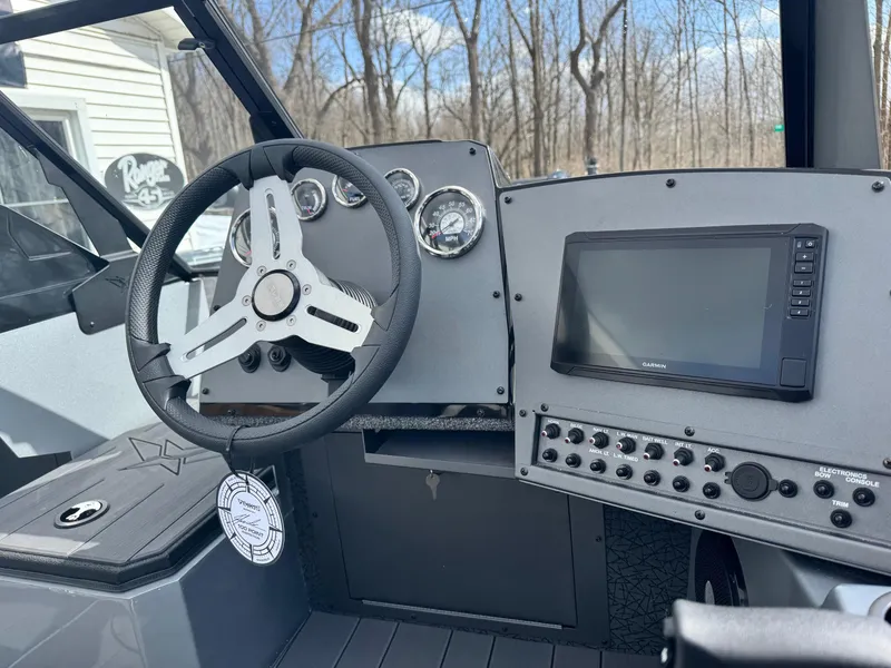 Slide: The Image of Interior of 2025 Vexus ADX190 boat with steering wheel and control panel. - 5