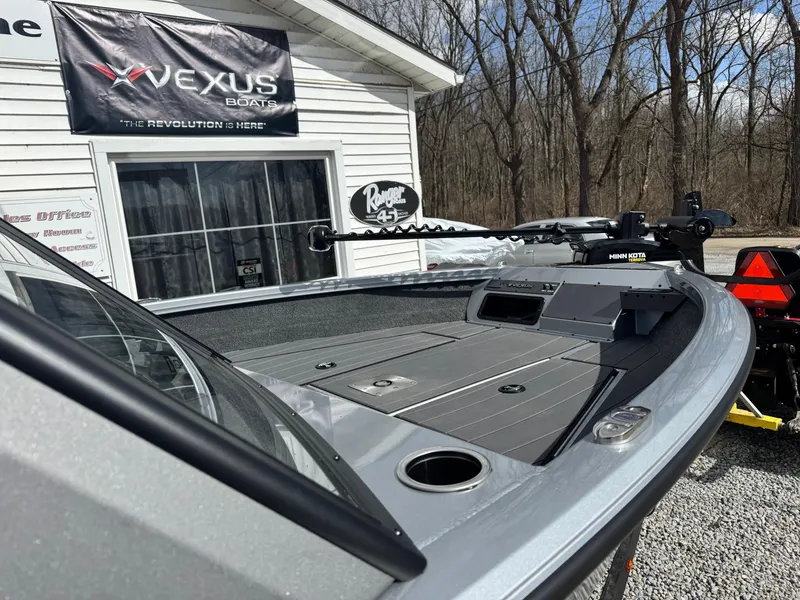 Slide: The Image of 2025 Vexus ADX190 boat displayed outdoors, featuring sleek design and advanced equipment. - 6
