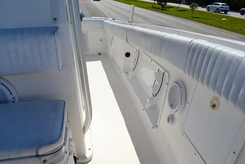 Slide: The Image of 2006 Clearwater 2500 WI CC boat interior with white seating and storage compartments. - 20