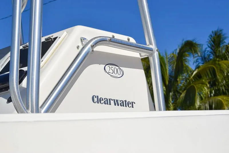 Slide: The Image of 2006 Clearwater 2500 WI CC boat with palm trees in the background. - 3