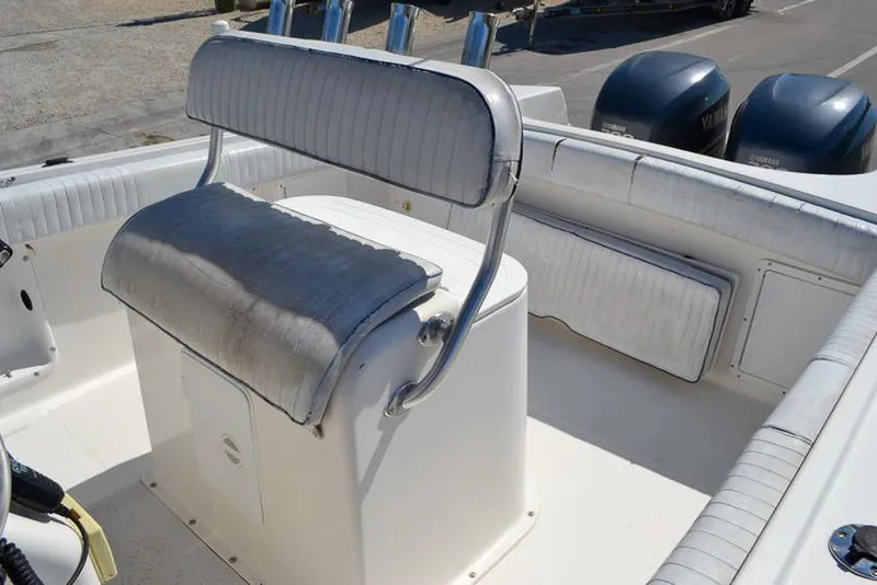 Slide: The Image of 2006 Clearwater 2500 WI CC boat interior with cushioned seating and dual engines. - 9