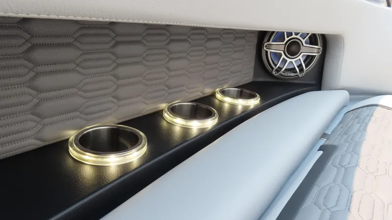 Slide: The Image of Luxurious MTI 50v 2022 interior with illuminated cup holders and sleek speaker design. - 19