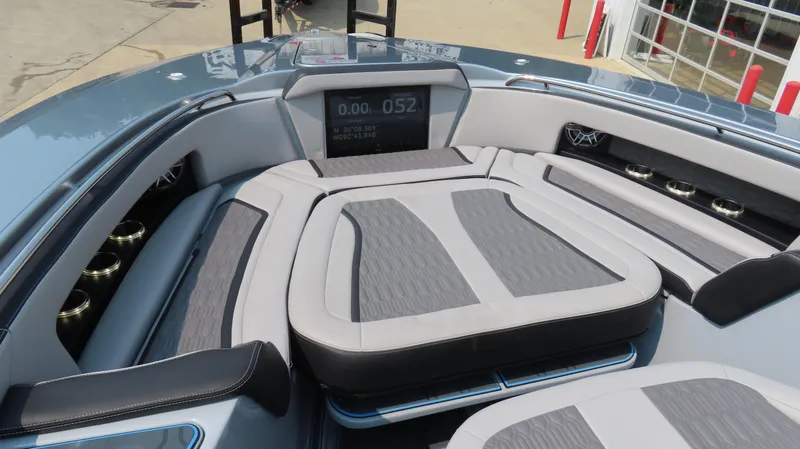 Slide: The Image of 2022 MTI 50v boat interior with cushioned seating and digital display. - 22