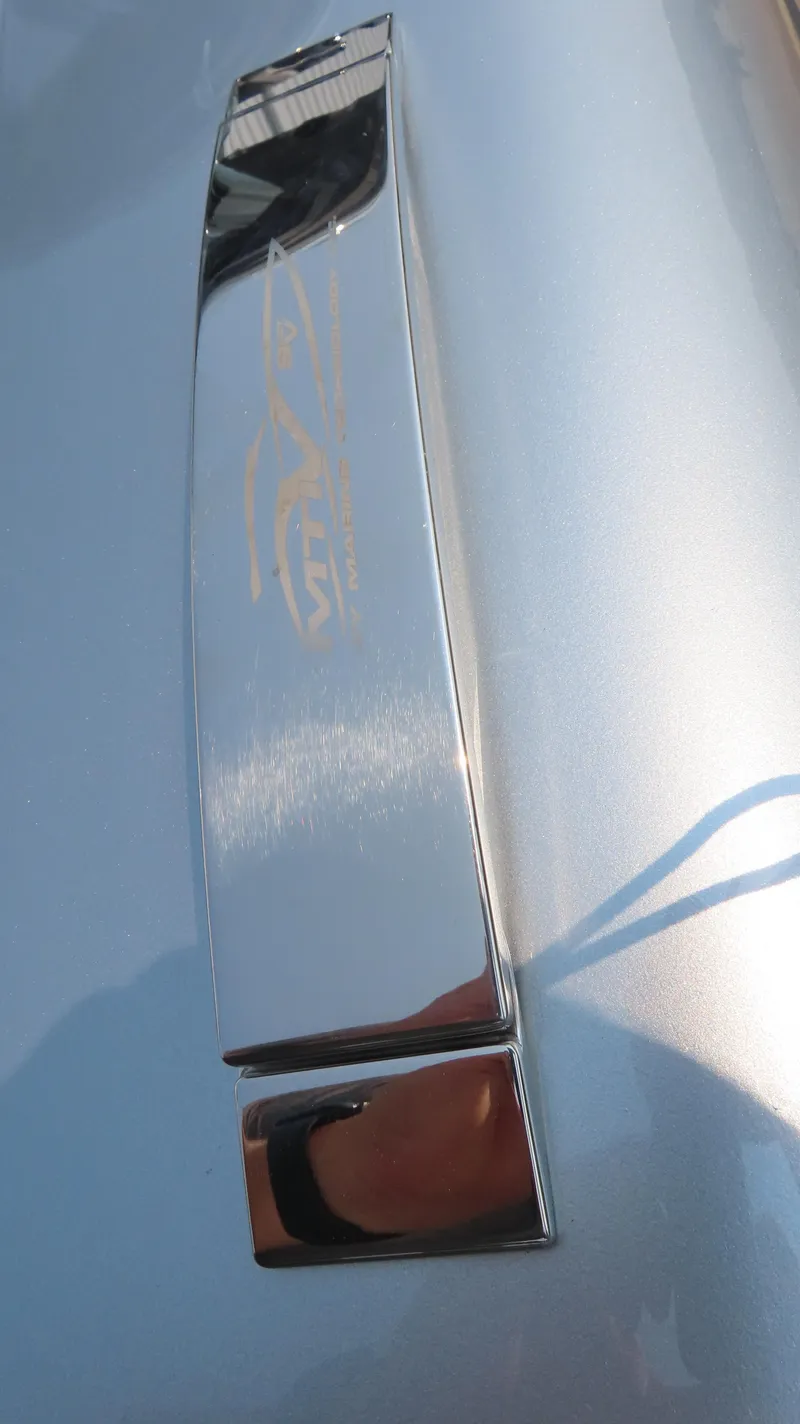 Slide: The Image of Chrome handle on MTI 50v, 2022 model, reflecting light. - 26