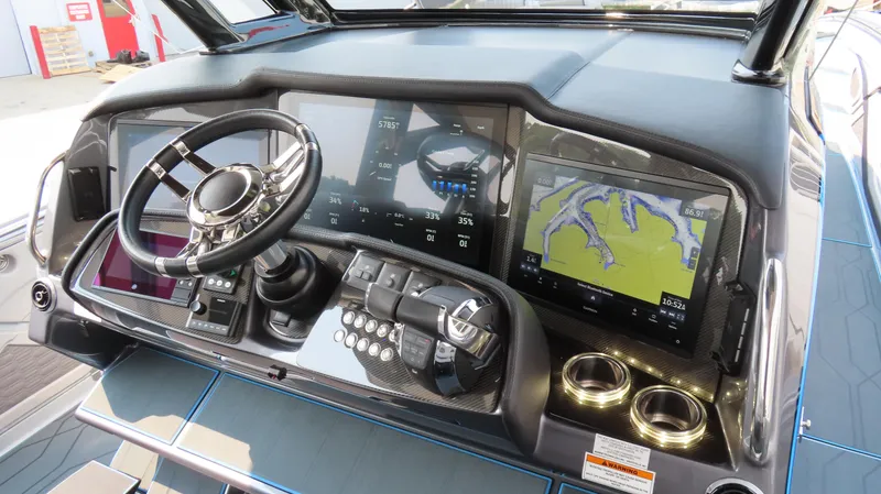 Slide: The Image of Helm of 2022 MTI 50v boat with advanced navigation displays and controls. - 30