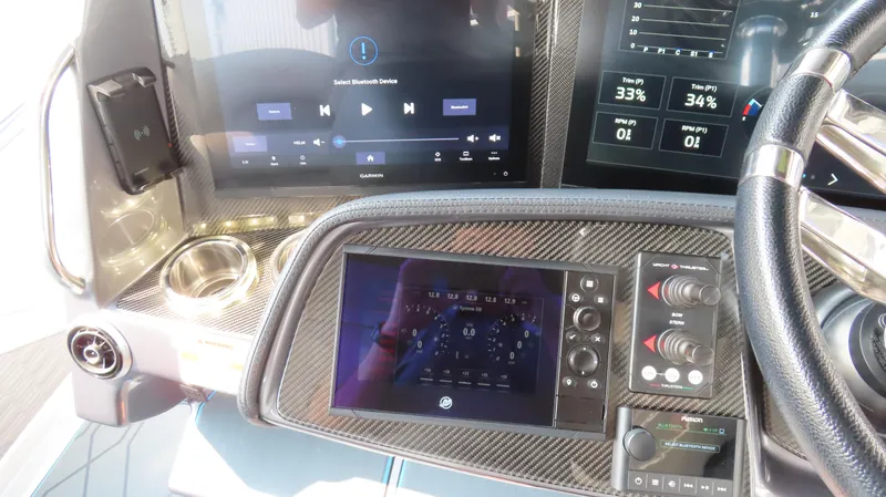 Slide: The Image of Dashboard of 2022 MTI 50v boat with digital displays and controls. - 34