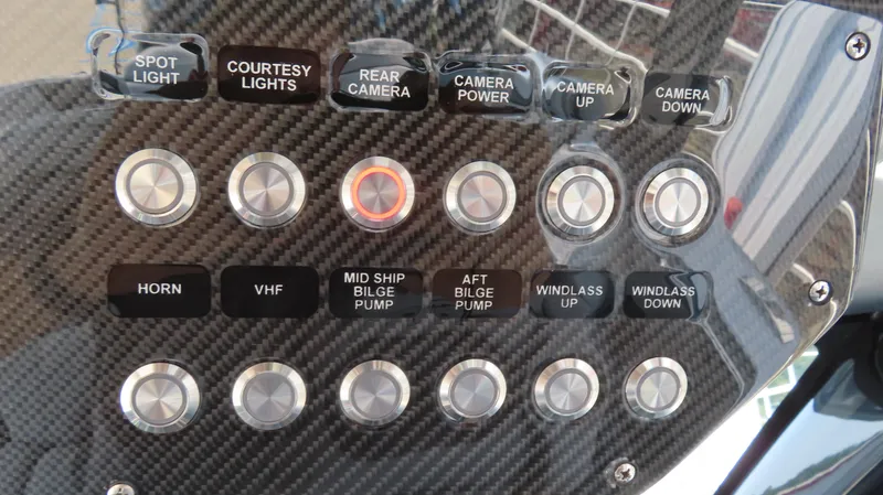 Slide: The Image of Control panel of MTI 50v 2022 boat with various function buttons. - 36