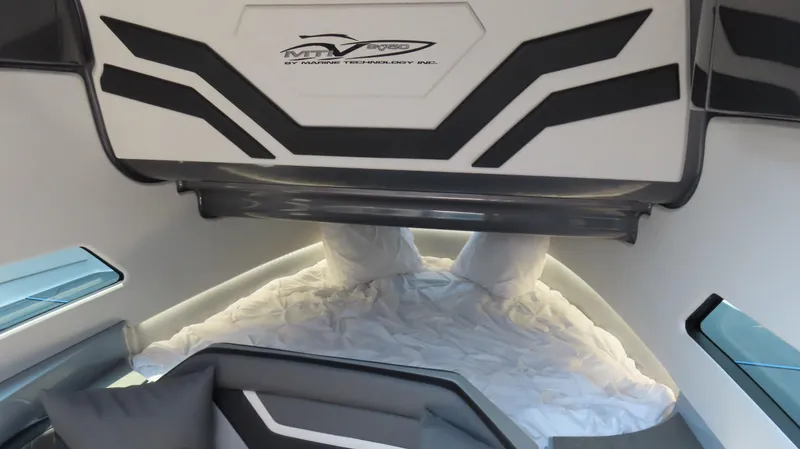 Slide: The Image of Modern MTI 50v 2022 boat interior with sleek design and comfortable bedding. - 42