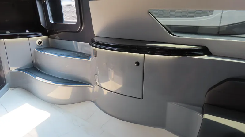 Slide: The Image of Interior of 2022 MTI 50v boat, featuring sleek gray design and modern cabinetry. - 44