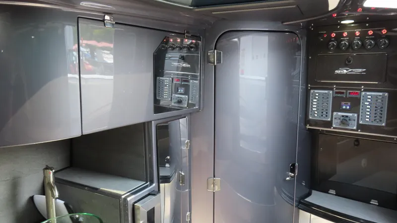 Slide: The Image of Interior of 2022 MTI 50v boat with sleek control panels and storage cabinets. - 47