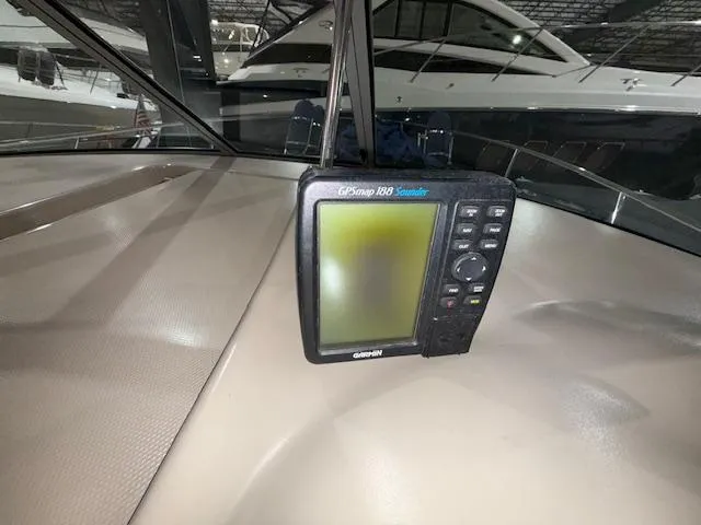Slide: The Image of GPS navigation system on 2003 Sea Ray 280 Sundancer boat dashboard. - 10
