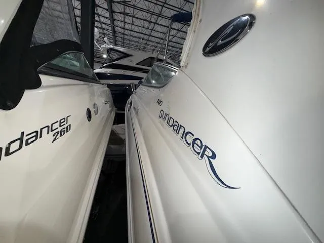 Slide: The Image of 2003 Sea Ray 280 Sundancer and 260 Sundancer boats in storage facility. - 2