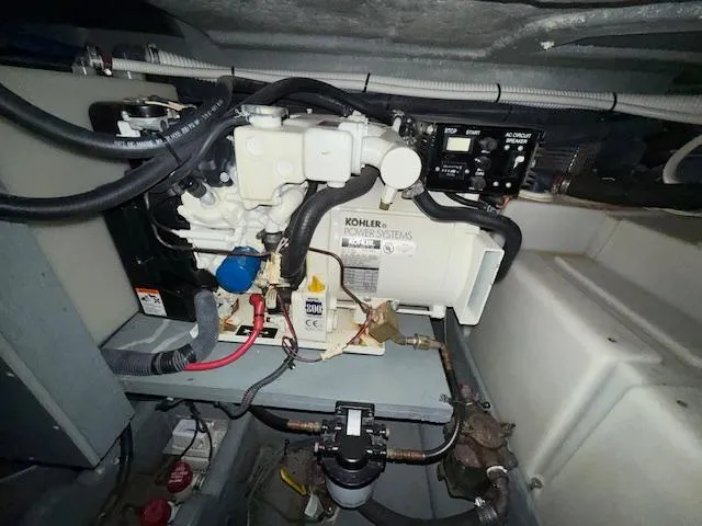 Slide: The Image of Engine compartment of 2003 Sea Ray 280 Sundancer with Kohler power system. - 23