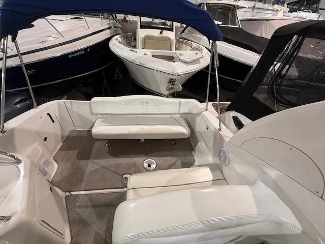 Slide: The Image of 2003 Sea Ray 280 Sundancer boat interior with seating and canopy. - 4