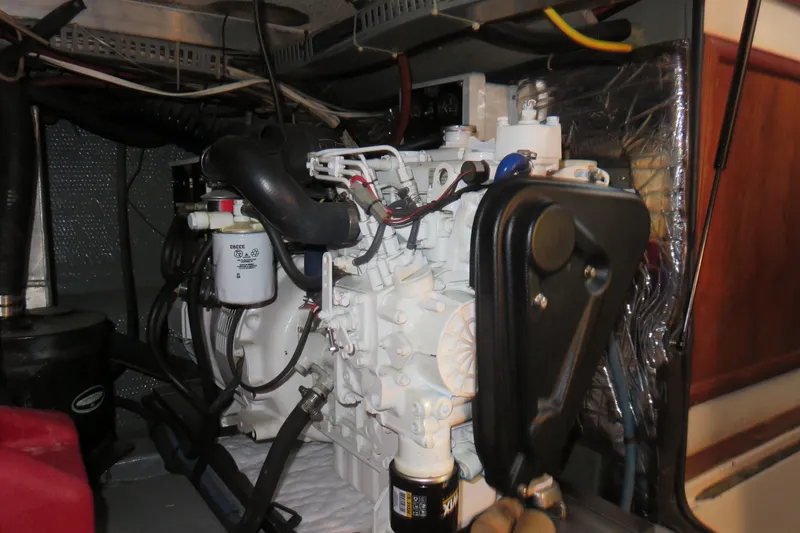 Slide: The Image of Engine room of 1988 Carver 42 Aft Cabin Motor Yacht, showcasing mechanical components. - 104