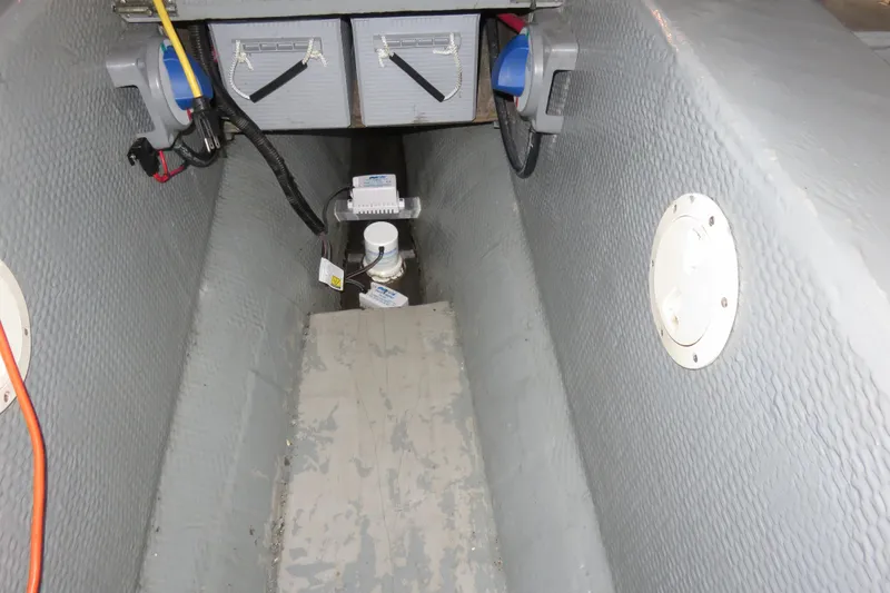 Slide: The Image of 1988 Carver 42 Aft Cabin Motor Yacht interior, showing electrical and plumbing components. - 105