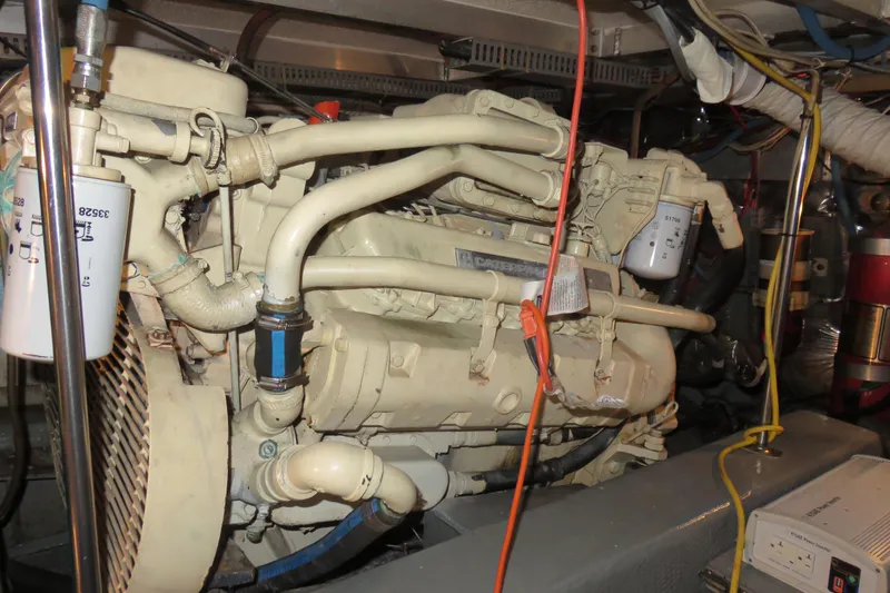 Slide: The Image of Engine room of 1988 Carver 42 Aft Cabin Motor Yacht, showcasing detailed machinery components. - 108