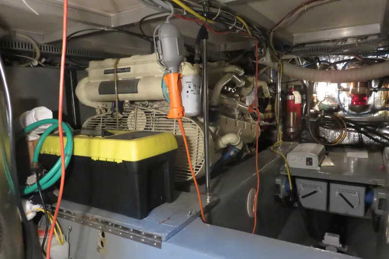 Slide: The Image of Engine room of 1988 Carver 42 Aft Cabin Motor Yacht with visible equipment and wiring. - 109