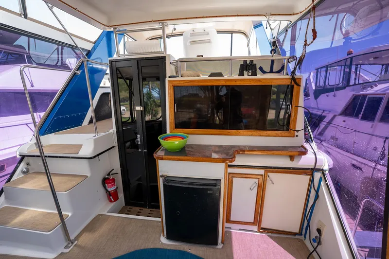Slide: The Image of 1988 Carver 42 Aft Cabin Motoryacht interior with kitchenette and stairs. - 36