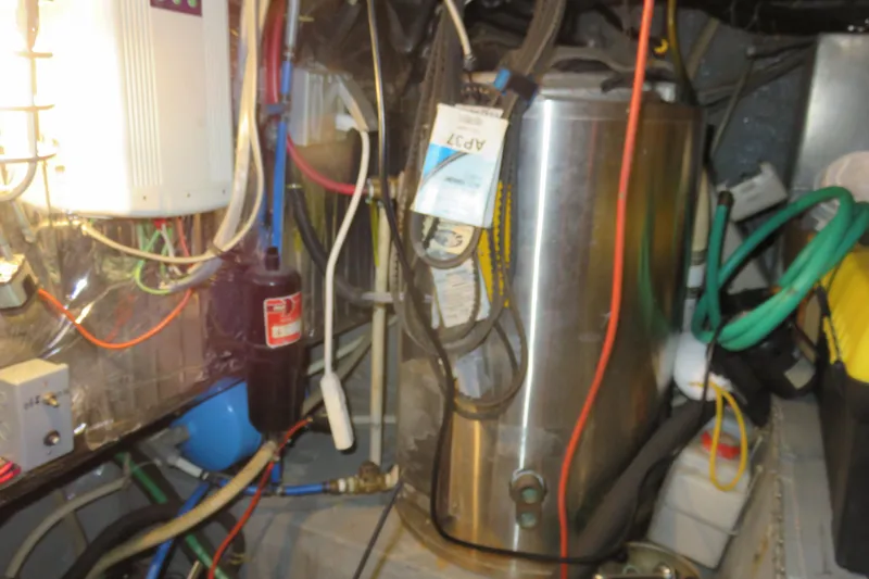 Slide: The Image of Engine room of 1988 Carver 42 Aft Cabin Motor Yacht with wiring and equipment. - 107