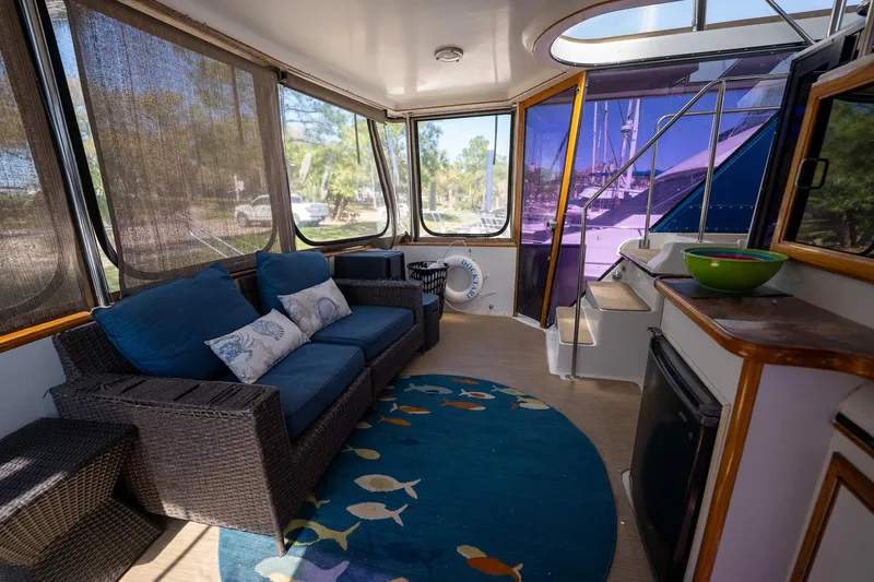 Slide: The Image of 1988 Carver 42 Aft Cabin Motoryacht interior with cozy seating and nautical decor. - 26