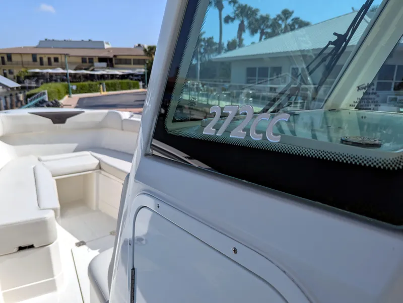 Slide: The Image of 2023 Sailfish 272 CC boat, featuring sleek design and spacious seating area. - 11
