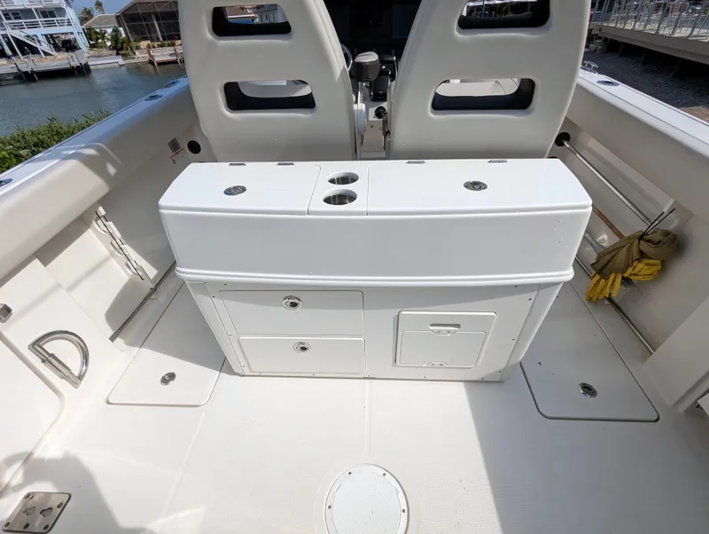 Slide: The Image of 2023 Sailfish 272 CC boat interior with storage compartments and seating. - 19