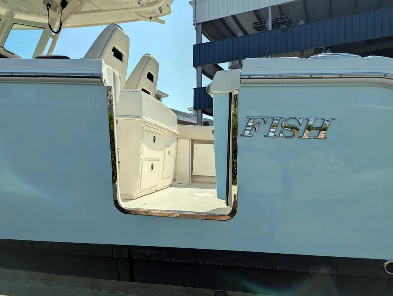 Slide: The Image of 2023 Sailfish 272 CC boat with open side door and seating area. - 25