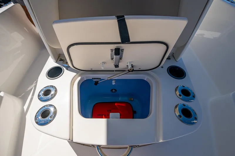 Slide: The Image of Open storage compartment on 2020 Boston Whaler 210 Dauntless boat. - 14