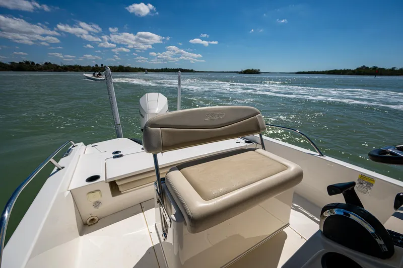 Slide: The Image of 2020 Boston Whaler 210 Dauntless boat on water, sunny day, clear skies. - 7