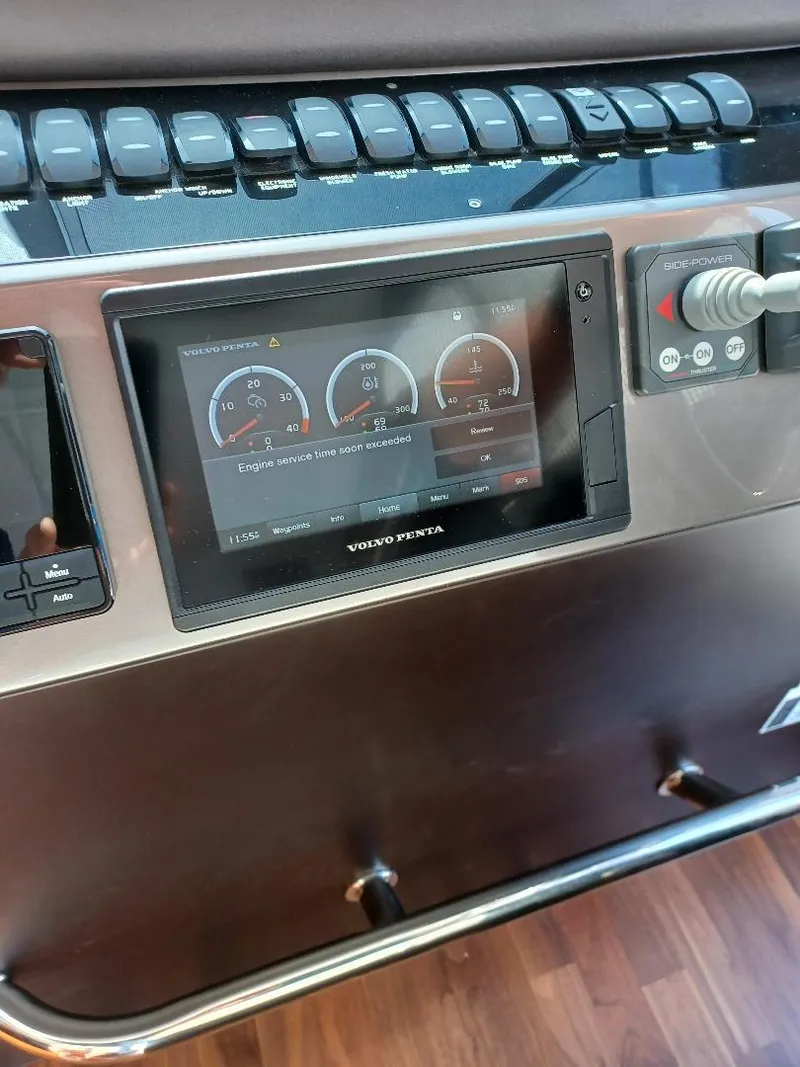 Slide: The Image of Control panel of a 2022 Galeon 410 HTC yacht with digital display and controls. - 20