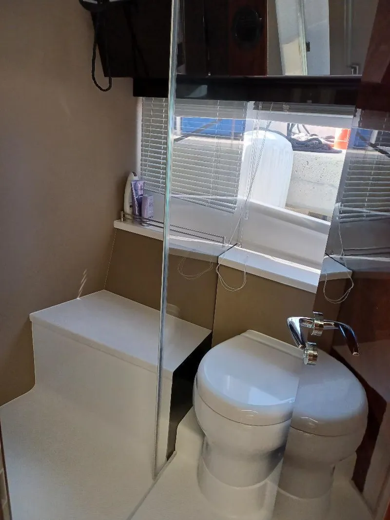 Slide: The Image of Bathroom interior of 2022 Galeon 410 HTC yacht with modern fixtures and compact design. - 24