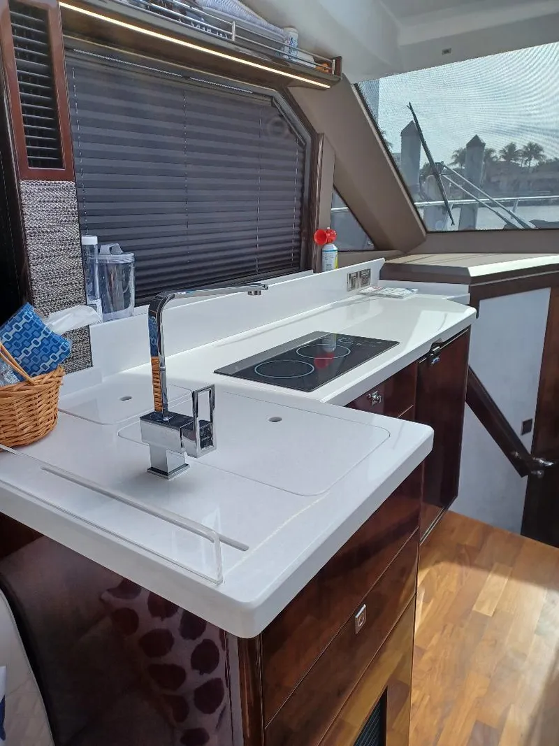 Slide: The Image of Modern kitchen interior of 2022 Galeon 410 HTC yacht with sleek countertops and appliances. - 37
